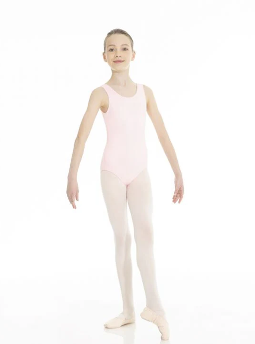 A young child in a ballet class with one foot stretched forward. Her arms are sloping gently down and outward from her shoulders.