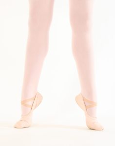 Young dancer at Leica Hardy School of Dance on demi-pointe, second position, high arch, for Words to Dance By blog 'When to Start Pointe'.